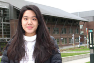 Smiling young woman with long dark hair